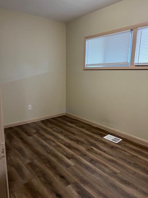 885-887 Derrer Rd, Columbus, OH 43204 - empty room with dark wood-style floors