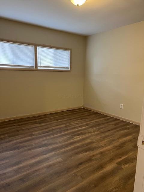 885-887 Derrer Rd, Columbus, OH 43204 - spare room with dark wood-type flooring and baseboards