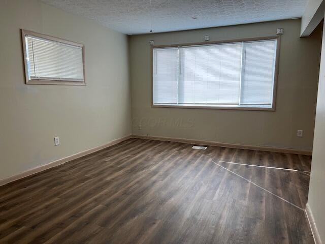 885-887 Derrer Rd, Columbus, OH 43204 - empty room featuring wood finished floors and a textured ceiling