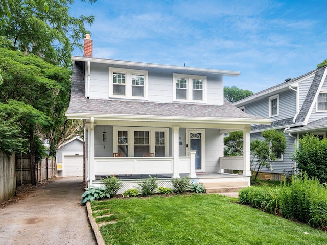 1368 Elmwood Ave, Columbus, OH 43212 - view of front of home featuring covered porch, a chimney, a garage, an outbuilding, and roof with shingles