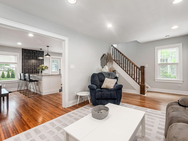 1368 Elmwood Ave, Columbus, OH 43212 - living room with stairway, plenty of natural light, light wood-style floors, and recessed lighting