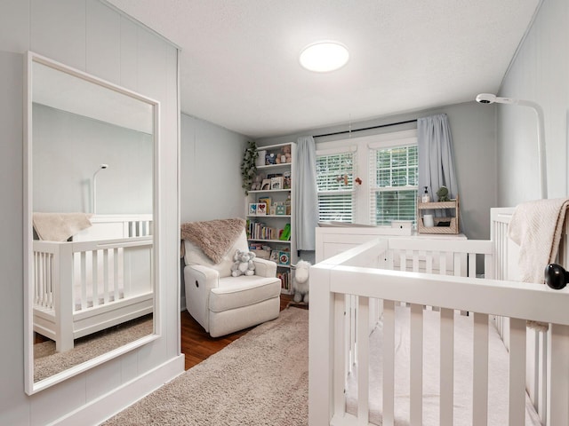 1368 Elmwood Ave, Columbus, OH 43212 - bedroom featuring wood finished floors and a nursery area