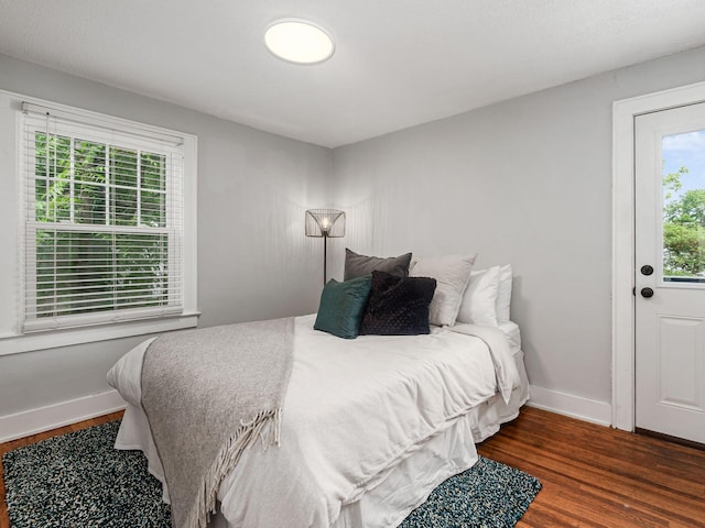 1368 Elmwood Ave, Columbus, OH 43212 - bedroom with multiple windows and wood finished floors