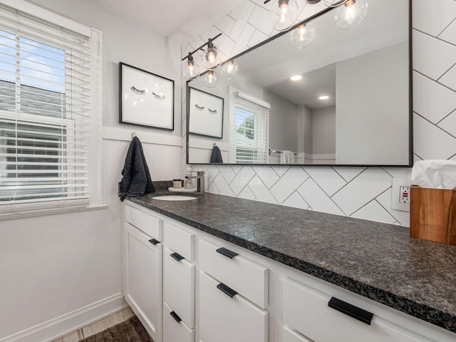 1368 Elmwood Ave, Columbus, OH 43212 - bathroom featuring tasteful backsplash, vanity, and wood finished floors
