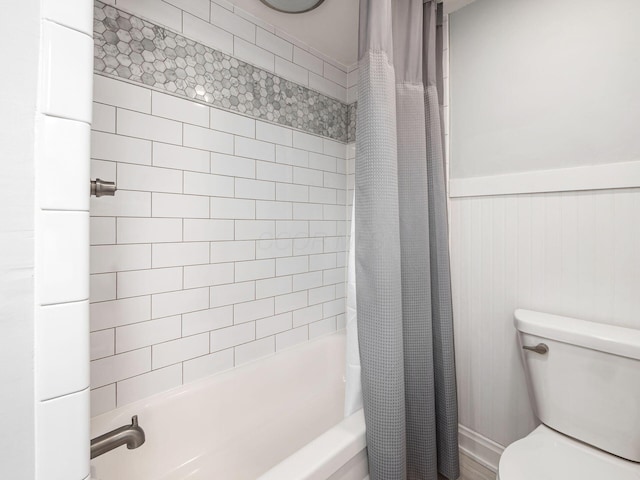 1368 Elmwood Ave, Columbus, OH 43212 - bathroom featuring shower / bathtub combination with curtain and a wainscoted wall
