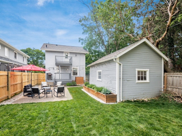 1368 Elmwood Ave, Columbus, OH 43212 - rear view of house with an outdoor living space, a balcony, a fenced backyard, a patio area, and an outbuilding