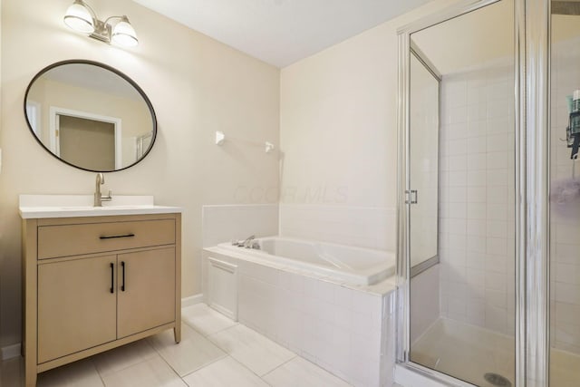 5535 Village Xing, Hilliard, OH 43026 - full bathroom featuring vanity, a stall shower, a garden tub, and tile patterned floors
