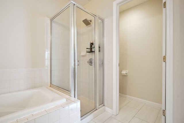 5535 Village Xing, Hilliard, OH 43026 - bathroom featuring a stall shower, a garden tub, and tile patterned flooring