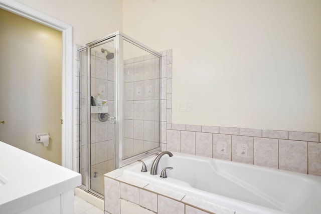 5535 Village Xing, Hilliard, OH 43026 - bathroom featuring a stall shower, a bath, and vanity