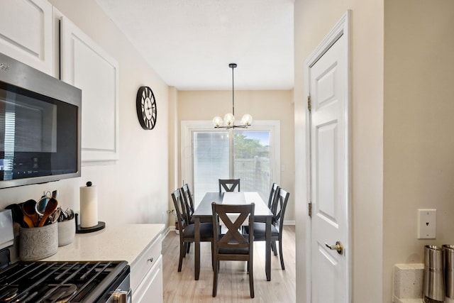 5535 Village Xing, Hilliard, OH 43026 - dining space with a chandelier and light wood finished floors