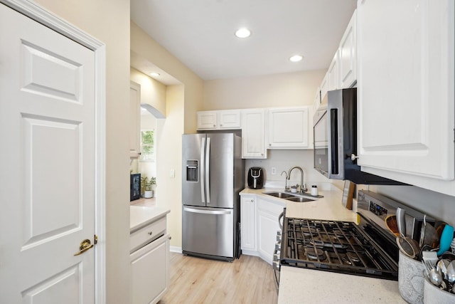 5535 Village Xing, Hilliard, OH 43026 - kitchen with appliances with stainless steel finishes, white cabinetry, light countertops, and recessed lighting
