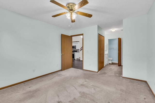978 Kingsbury Ct, Newark, OH 43055 - unfurnished bedroom featuring light colored carpet, ensuite bath, and a ceiling fan