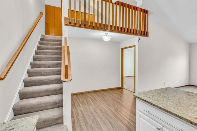 978 Kingsbury Ct, Newark, OH 43055 - stairs with wood finished floors and baseboards