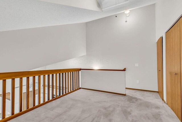 978 Kingsbury Ct, Newark, OH 43055 - hall featuring vaulted ceiling, attic access, and carpet floors