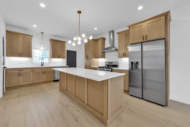 376 E Markison Ave, Columbus, OH 43207 - kitchen with wall chimney range hood, stainless steel appliances, light wood-style floors, backsplash, and recessed lighting