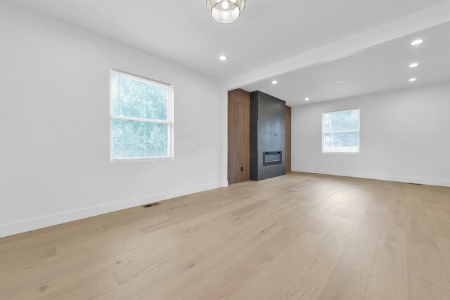 376 E Markison Ave, Columbus, OH 43207 - unfurnished living room featuring light wood-style floors and recessed lighting