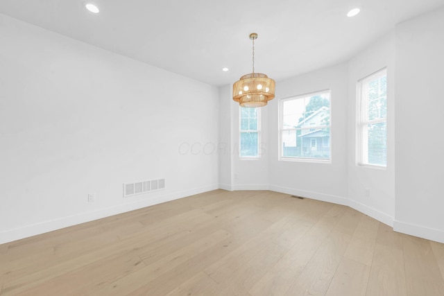 376 E Markison Ave, Columbus, OH 43207 - empty room with a chandelier, recessed lighting, and light wood-type flooring