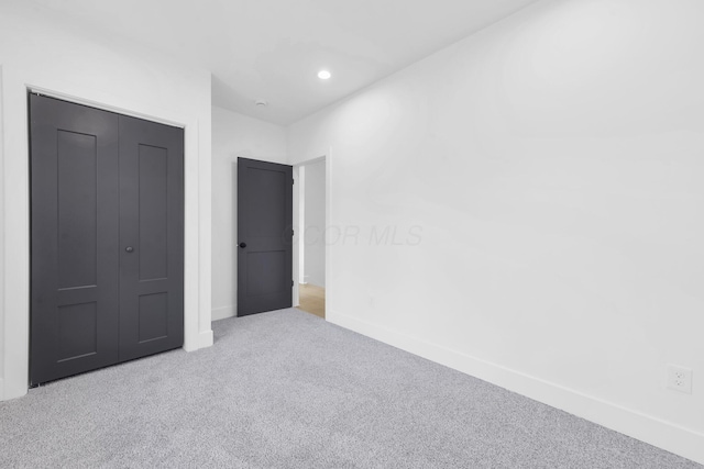 376 E Markison Ave, Columbus, OH 43207 - unfurnished bedroom featuring carpet flooring, recessed lighting, and a closet