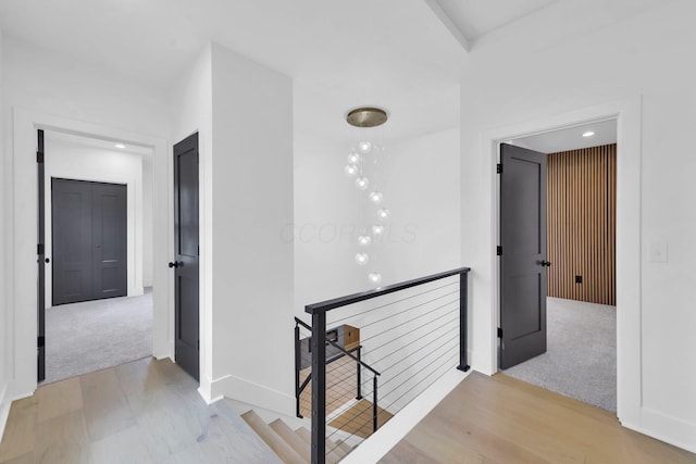 376 E Markison Ave, Columbus, OH 43207 - corridor featuring an upstairs landing, light carpet, light wood-style flooring, and recessed lighting