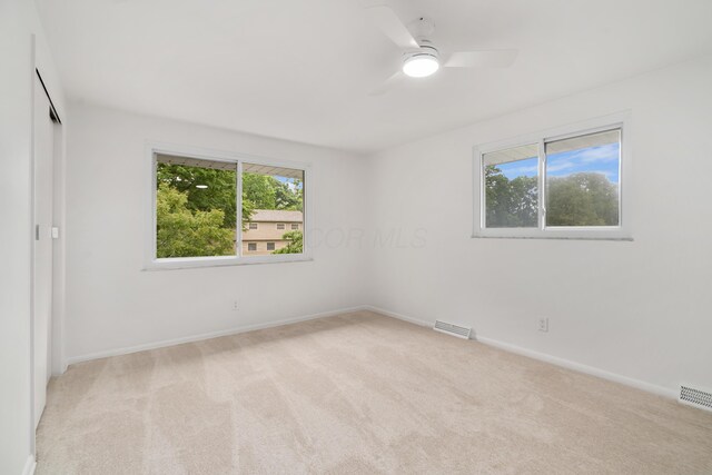 75 S Gould Rd, Columbus, OH 43209 - unfurnished bedroom featuring light colored carpet and a ceiling fan