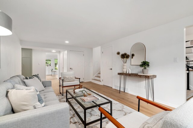 75 S Gould Rd, Columbus, OH 43209 - living room with stairs, wood finished floors, and recessed lighting