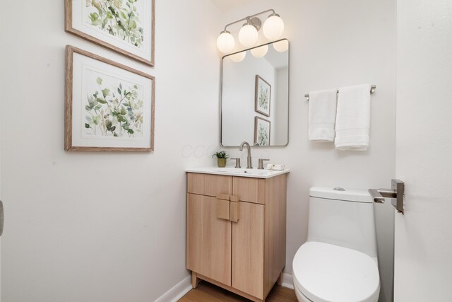 75 S Gould Rd, Columbus, OH 43209 - half bathroom with vanity and wood finished floors