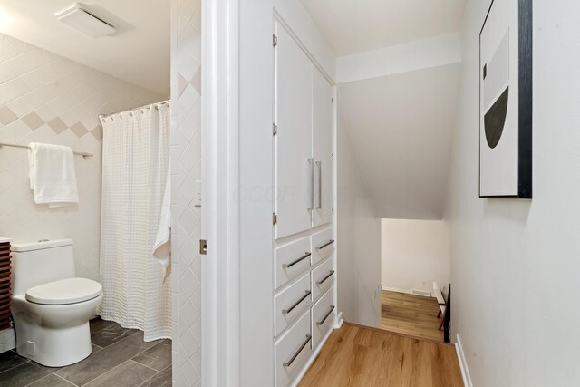 75 S Gould Rd, Columbus, OH 43209 - full bathroom featuring wood finished floors and a shower with shower curtain