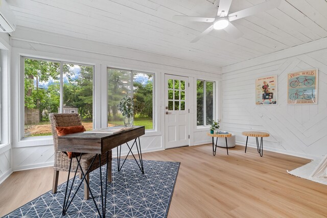 75 S Gould Rd, Columbus, OH 43209 - sunroom with healthy amount of natural light, wood finished floors, wooden ceiling, a wall mounted air conditioner, and a deck