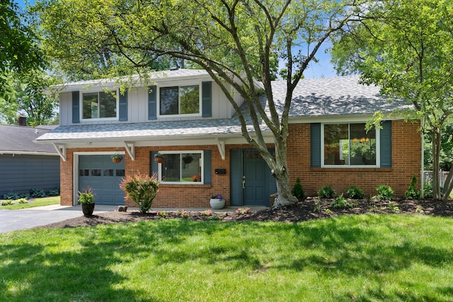 75 S Gould Rd, Columbus, OH 43209 - view of front of property with a garage, brick siding, and a front yard