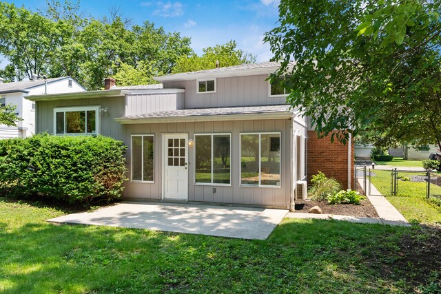 75 S Gould Rd, Columbus, OH 43209 - back of house featuring a patio, a gate, a chimney, and roof with shingles
