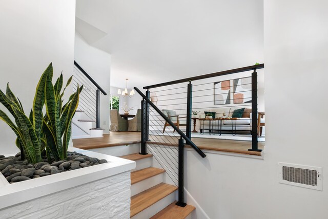 75 S Gould Rd, Columbus, OH 43209 - staircase with a chandelier and wood finished floors