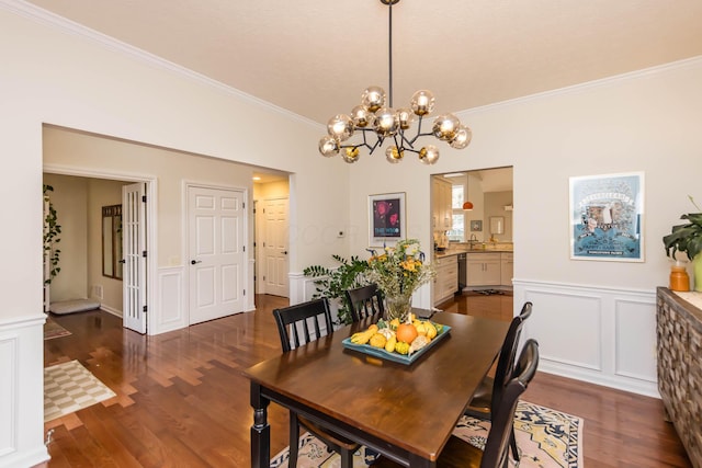 5893 Dunheath Loop, Dublin, OH 43016 - dining room with ornamental molding, wood finished floors, a wainscoted wall, a chandelier, and a decorative wall
