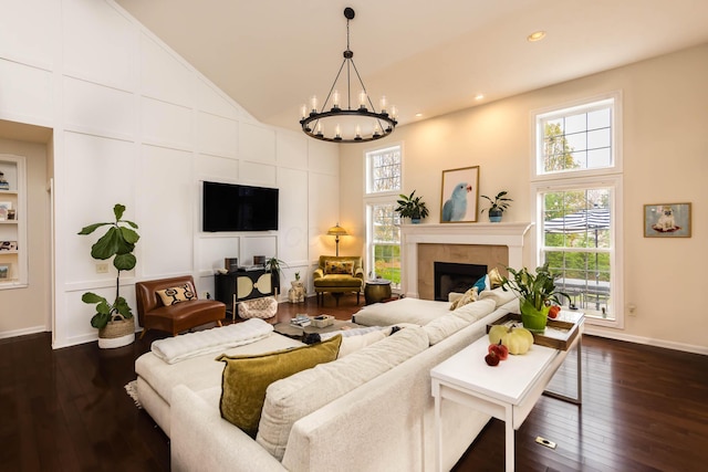 5893 Dunheath Loop, Dublin, OH 43016 - living area with healthy amount of natural light, a chandelier, dark wood-type flooring, high vaulted ceiling, and recessed lighting