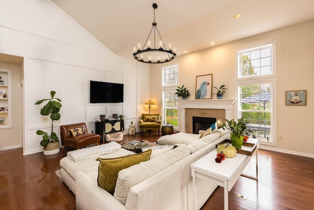 5893 Dunheath Loop, Dublin, OH 43016 - living area featuring healthy amount of natural light, a chandelier, dark wood-style flooring, high vaulted ceiling, and recessed lighting