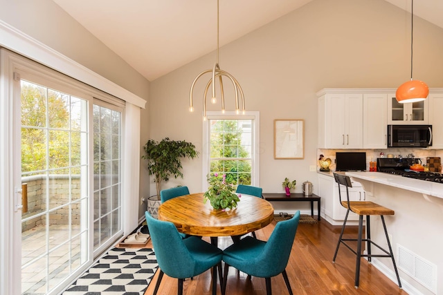 5893 Dunheath Loop, Dublin, OH 43016 - dining room with dark wood-style flooring and high vaulted ceiling