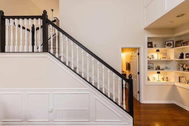 5893 Dunheath Loop, Dublin, OH 43016 - stairway with wood finished floors and a decorative wall