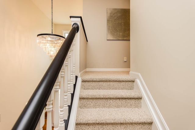 5893 Dunheath Loop, Dublin, OH 43016 - staircase with a chandelier and carpet floors
