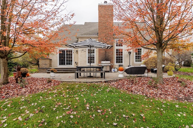 5893 Dunheath Loop, Dublin, OH 43016 - back of house featuring a patio area, a yard, and stucco siding