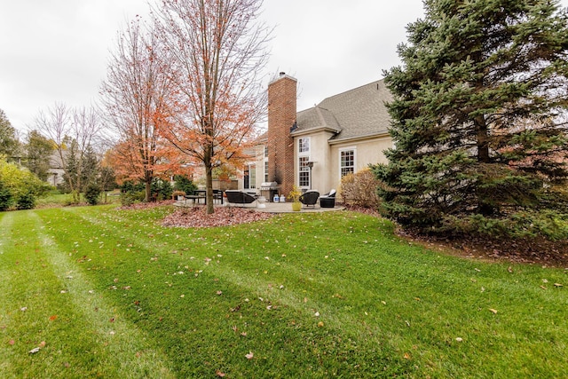 5893 Dunheath Loop, Dublin, OH 43016 - view of green lawn featuring a patio area