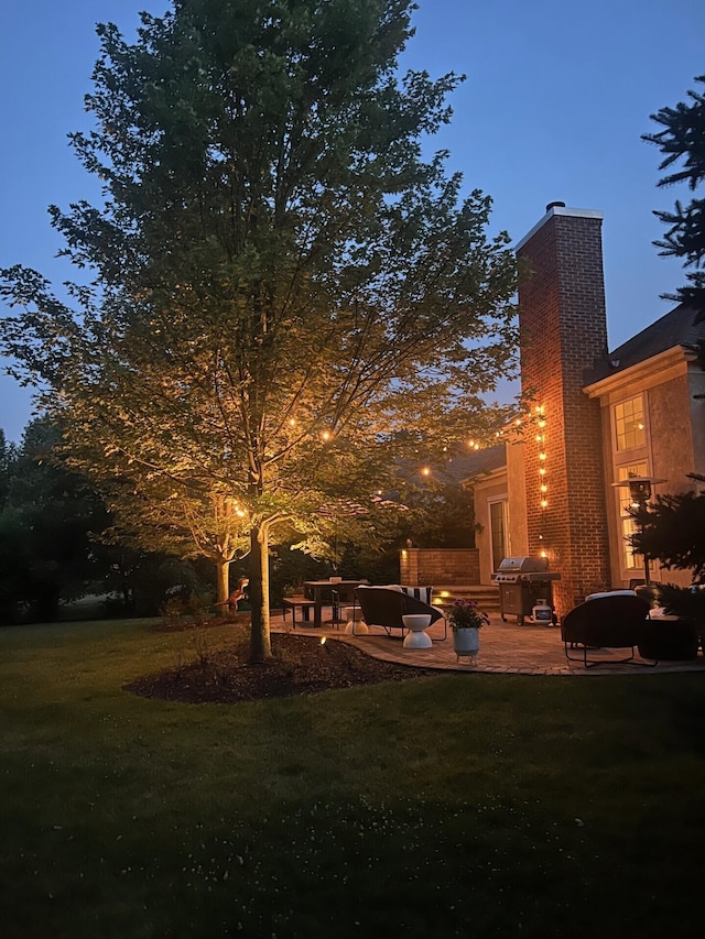 5893 Dunheath Loop, Dublin, OH 43016 - view of green lawn featuring a patio area