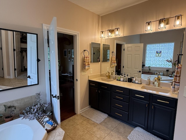 5893 Dunheath Loop, Dublin, OH 43016 - bathroom featuring double vanity, tile patterned flooring, and a bath