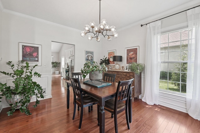 5893 Dunheath Loop, Dublin, OH 43016 - dining space featuring wood finished floors, plenty of natural light, ornamental molding, and a chandelier