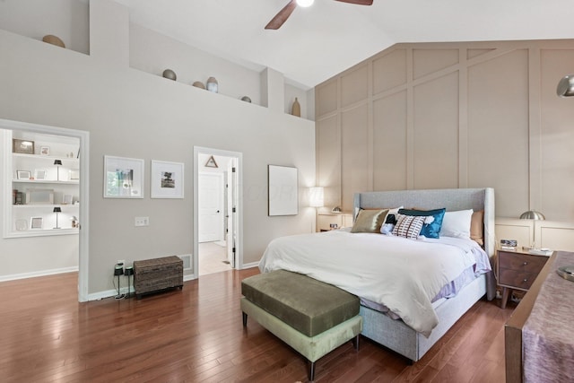 5893 Dunheath Loop, Dublin, OH 43016 - bedroom with dark wood-type flooring, high vaulted ceiling, ceiling fan, and a decorative wall