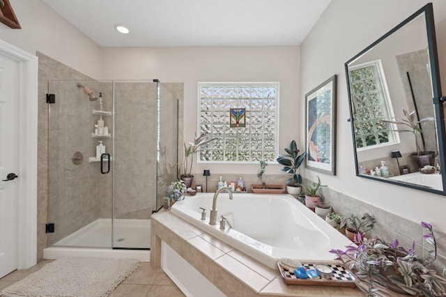 5893 Dunheath Loop, Dublin, OH 43016 - bathroom featuring a garden tub, tile patterned flooring, and a stall shower
