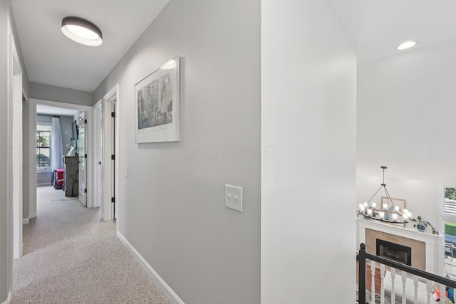 5893 Dunheath Loop, Dublin, OH 43016 - hallway featuring carpet floors and a chandelier