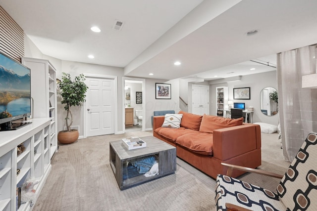 5893 Dunheath Loop, Dublin, OH 43016 - living room with light carpet, stairway, and recessed lighting