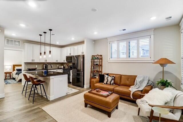 1301 Highland St, Columbus, OH 43201 - living area with light wood-style floors and recessed lighting