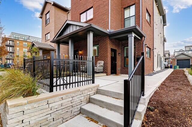 1301 Highland St, Columbus, OH 43201 - entrance to property with brick siding and covered porch