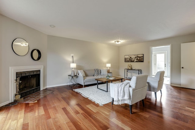 2356 Gavinley Way, Columbus, OH 43220 - living room featuring a fireplace, wood finished floors, and baseboards