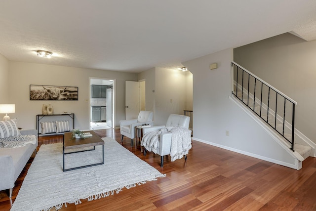 2356 Gavinley Way, Columbus, OH 43220 - living area with wood finished floors, baseboards, and stairway